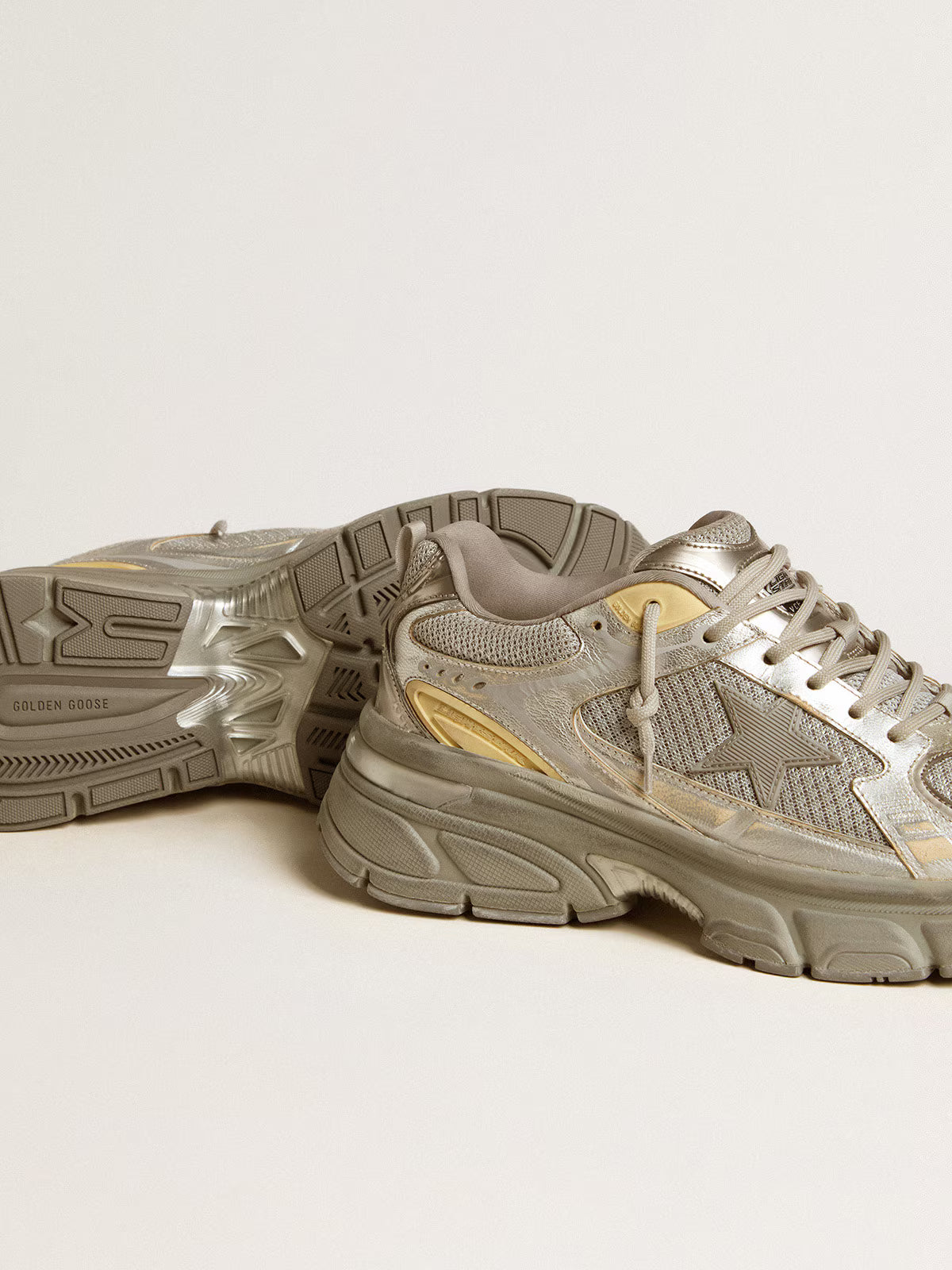 Golden Goose Lightstar sneakers featuring a metallic silver and grey leather