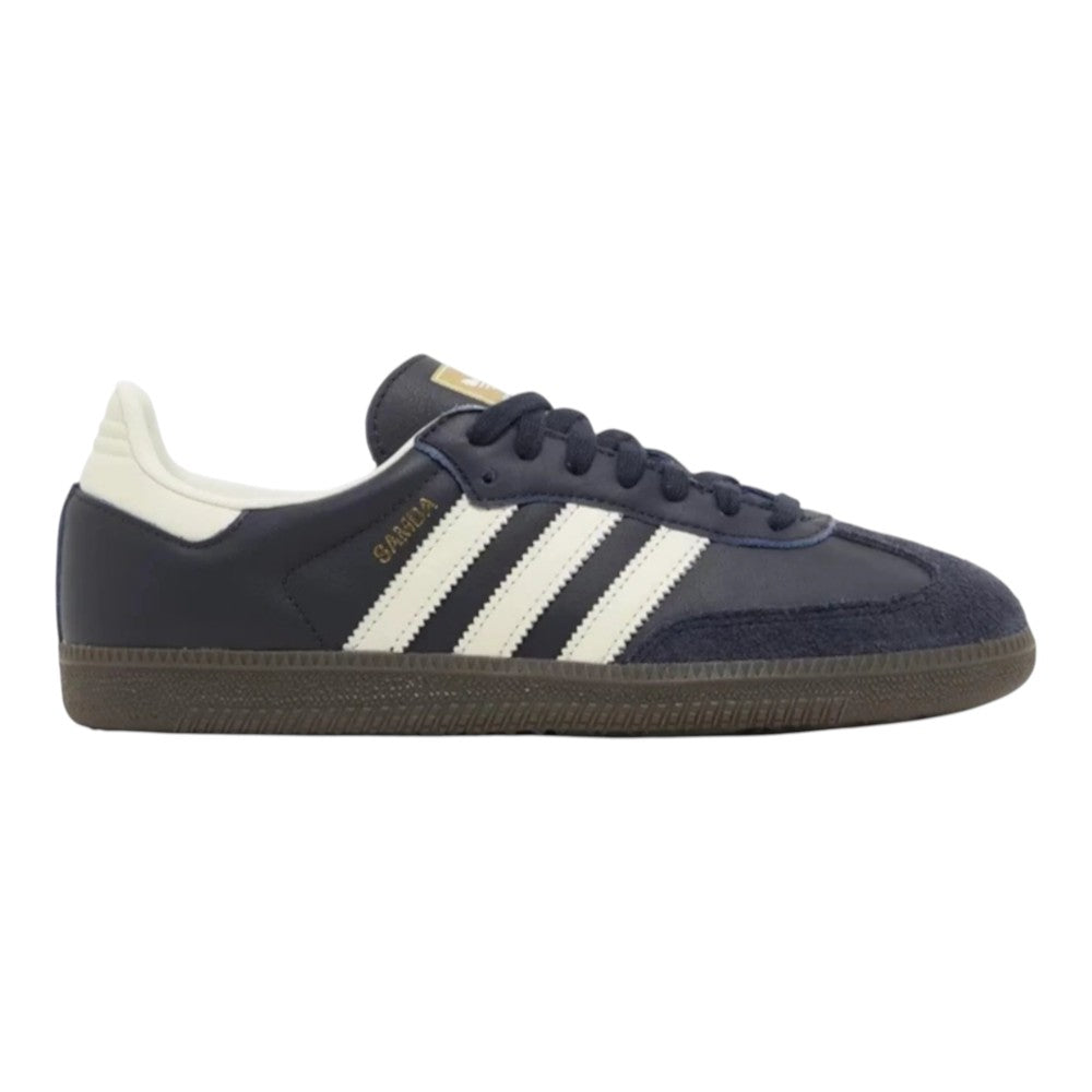 Luxurykicks.store Adidas Samba OG sneakers in night navy leather with white stripes, suede T-toe, and gum rubber sole.