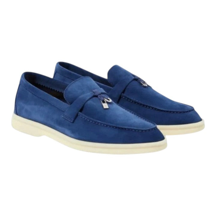 Luxurykicks.store Loro Piana Summer Walk blue suede loafers with white rubber soles and silver hardware detailing.