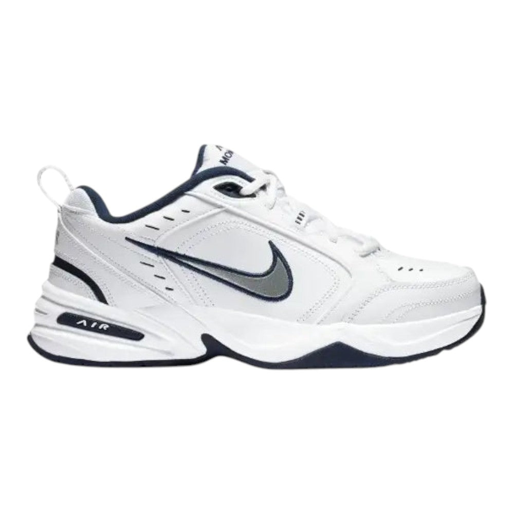 Luxurykicks.store Nike Air Monarch IV sneaker in white leather with navy blue accents and cushioned midsole.