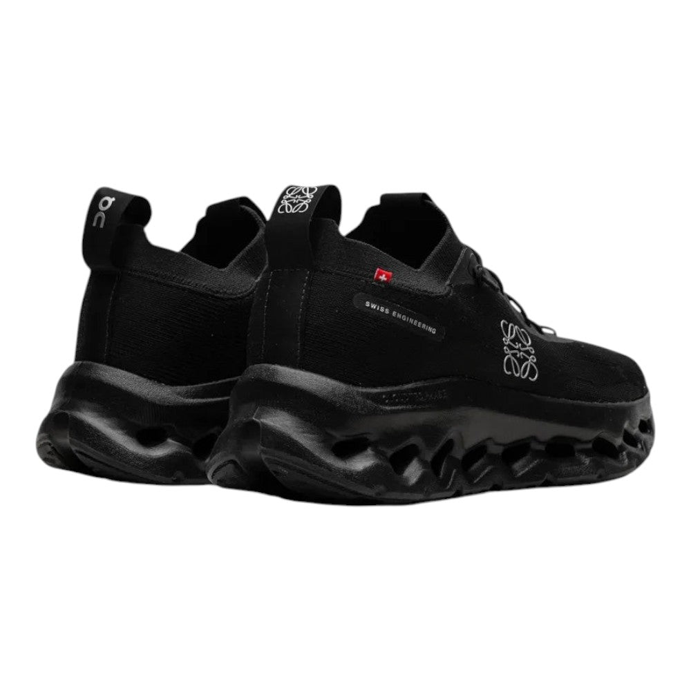 Luxurykicks.store On Running x Loewe Cloudtilt all black sneakers with signature CloudTec sole, rear view