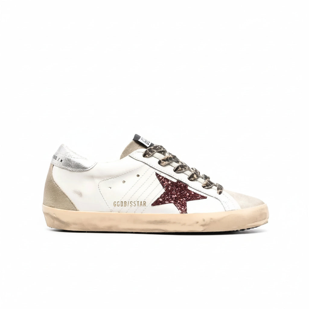 Golden Goose Super-Star sneaker in white leather with a burgundy glitter star, silver heel tab