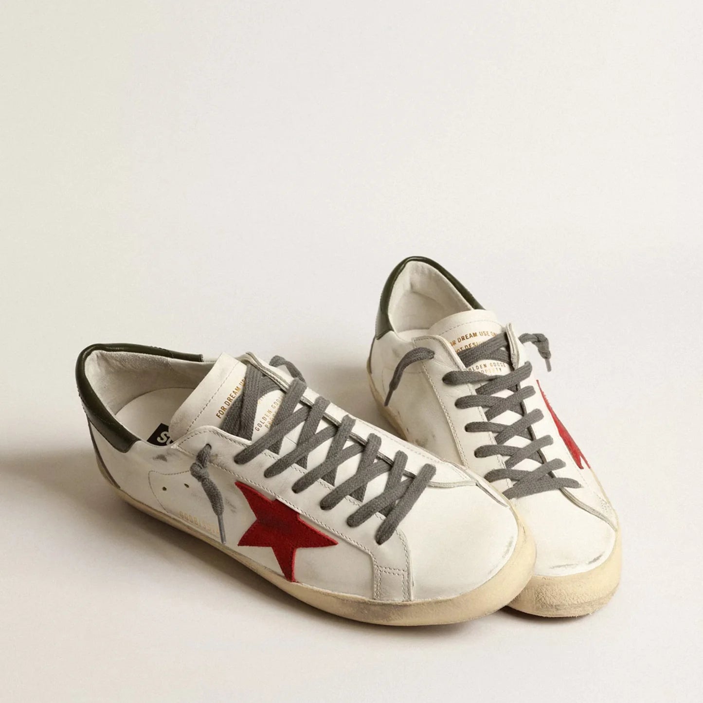 Golden Goose Super-Star with red suede star and green leather heel tab
