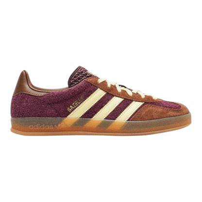 Luxurykicks.store adidas Gazelle Indoor sneaker in maroon suede with brown accents and a gum rubber sole.