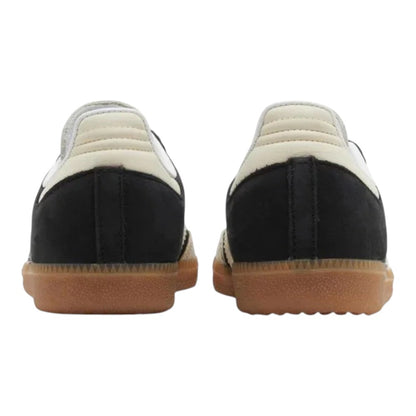 Luxurykicks.store Adidas Samba OG sneakers in black leather with white heel tabs and gum rubber outsoles, rear view.
