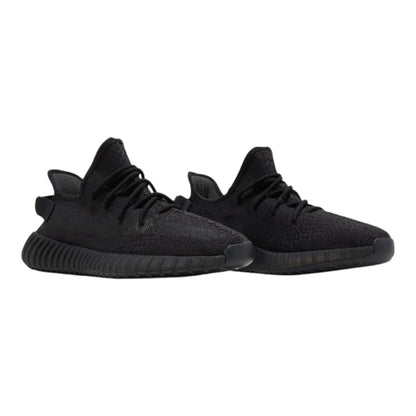 Luxurykicks.store adidas Yeezy Boost 350 V2 Onyx sneakers in black Primeknit with Boost cushioning and side stripe.