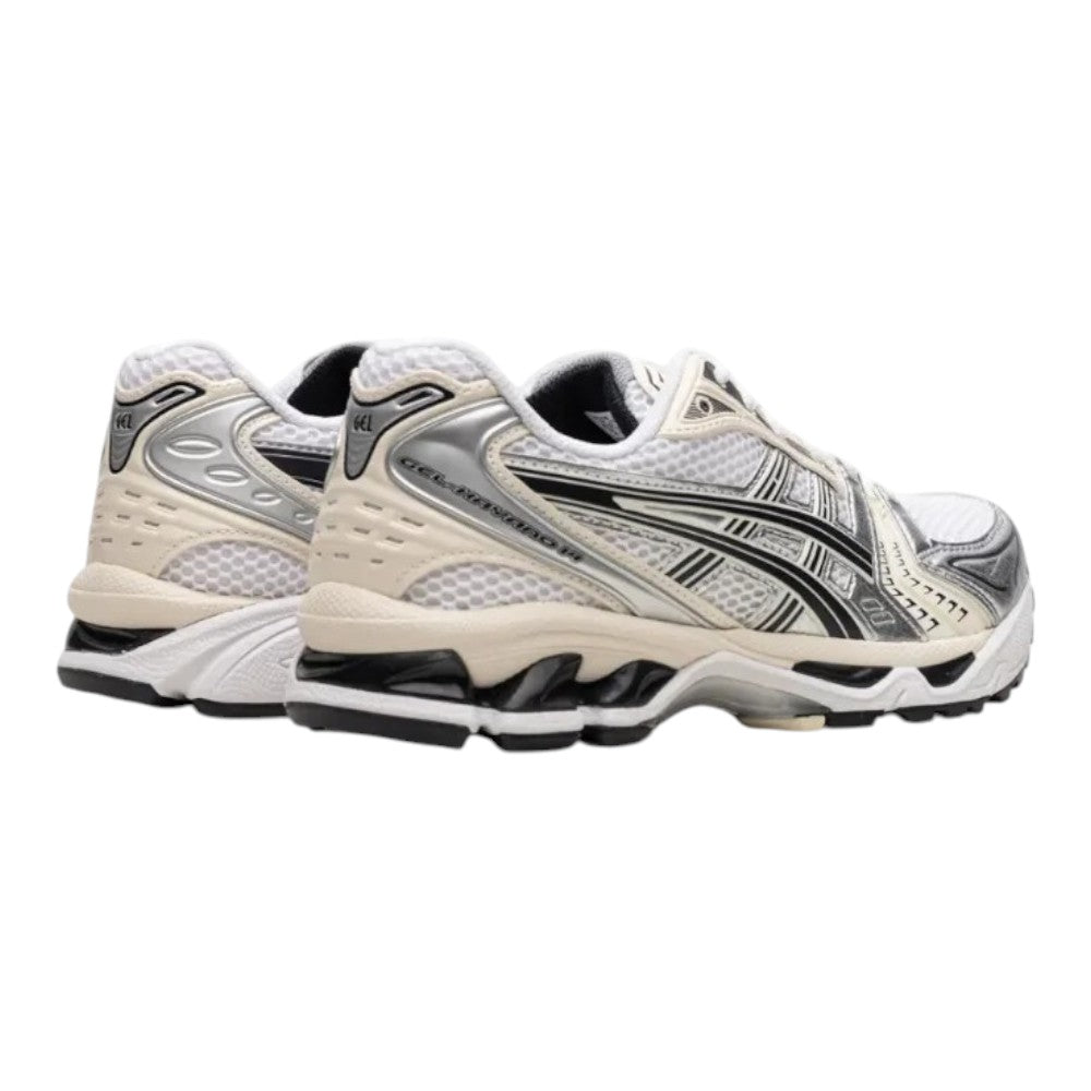 Luxurykicks.store ASICS Gel-Kayano 14 in white and midnight with mesh upper, silver overlays, and GEL heel cushioning.