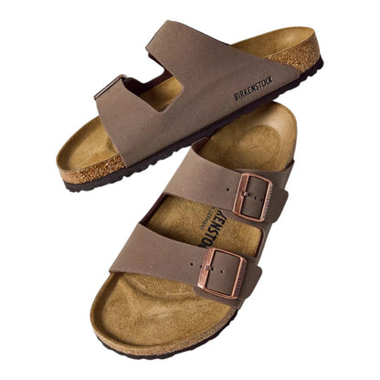 Luxurykicks.store Birkenstock Arizona sandals in brown Birko-Flor with cork-latex footbed and adjustable buckles.