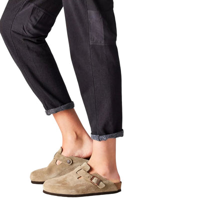 Luxurykicks.store Birkenstock Boston clog in taupe suede with adjustable strap and cork footbed worn on feet
