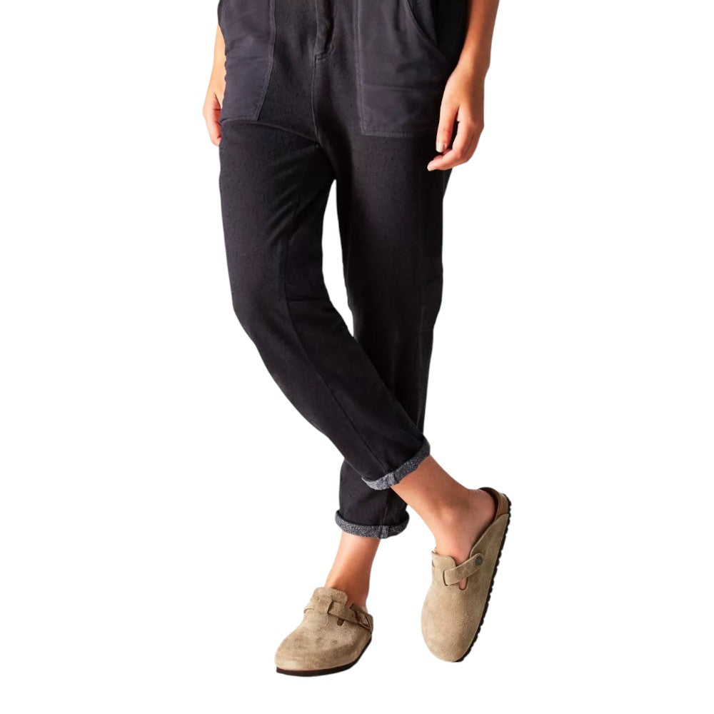 Luxurykicks.store Birkenstock Boston clogs in taupe suede with adjustable strap worn with black cuffed trousers