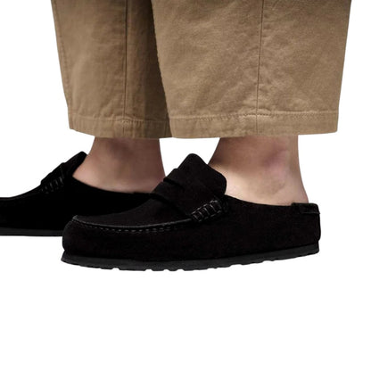 Luxurykicks.store Birkenstock Naples Wrapped black suede slip-on shoes with contoured footbed worn with tan trousers