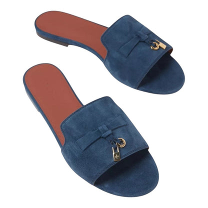 Luxurykicks.store blue suede sandals featuring a signature knot detail and gold-tone lock charm on a flat sole.