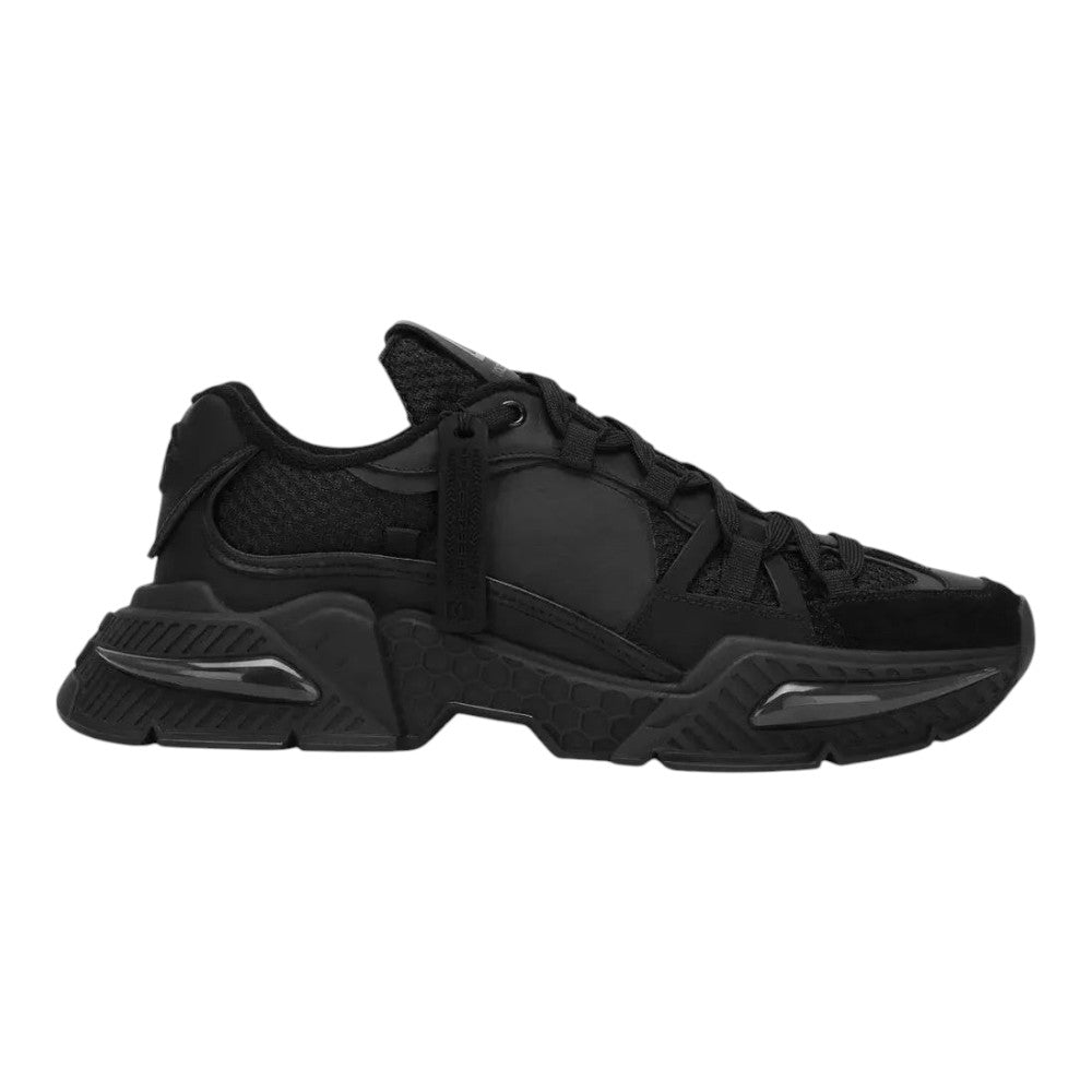 Luxurykicks.store Dolce & Gabbana Day Faster black panelled sneakers with a chunky textured sole and mesh detailing.