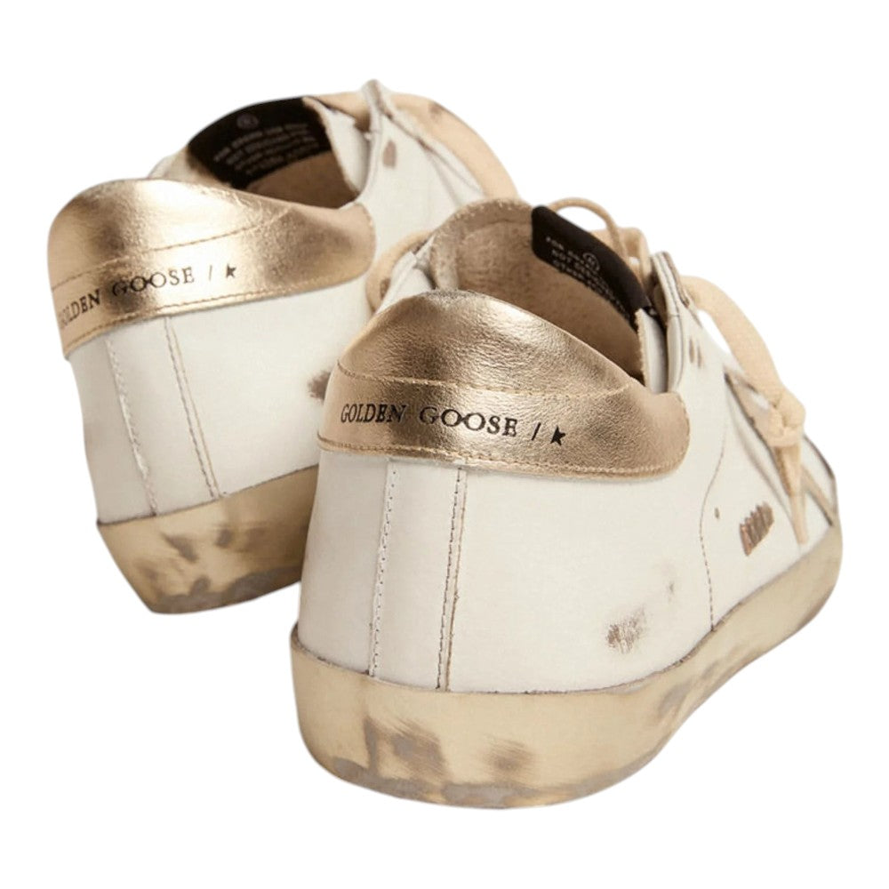 Luxurykicks.store Golden Goose Super Star sneakers in white and gold leather with a distressed vintage finish