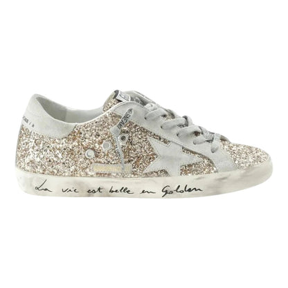 Luxurykicks.store Golden Goose Superstar low top sneakers in gold glitter with signature star and distressed sole