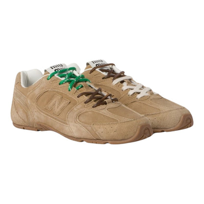 Luxurykicks.store Miu Miu X New Balance 530 SL suede sneakers in ecru with mismatched green and brown laces
