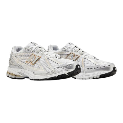 Luxurykicks.store New Balance 1906R sneakers in white and silver metallic with mesh and synthetic overlays.