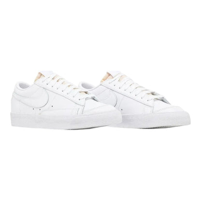 Luxurykicks.store Nike Blazer Low '77 Triple White sneakers featuring a clean all-white leather upper and rubber sole.