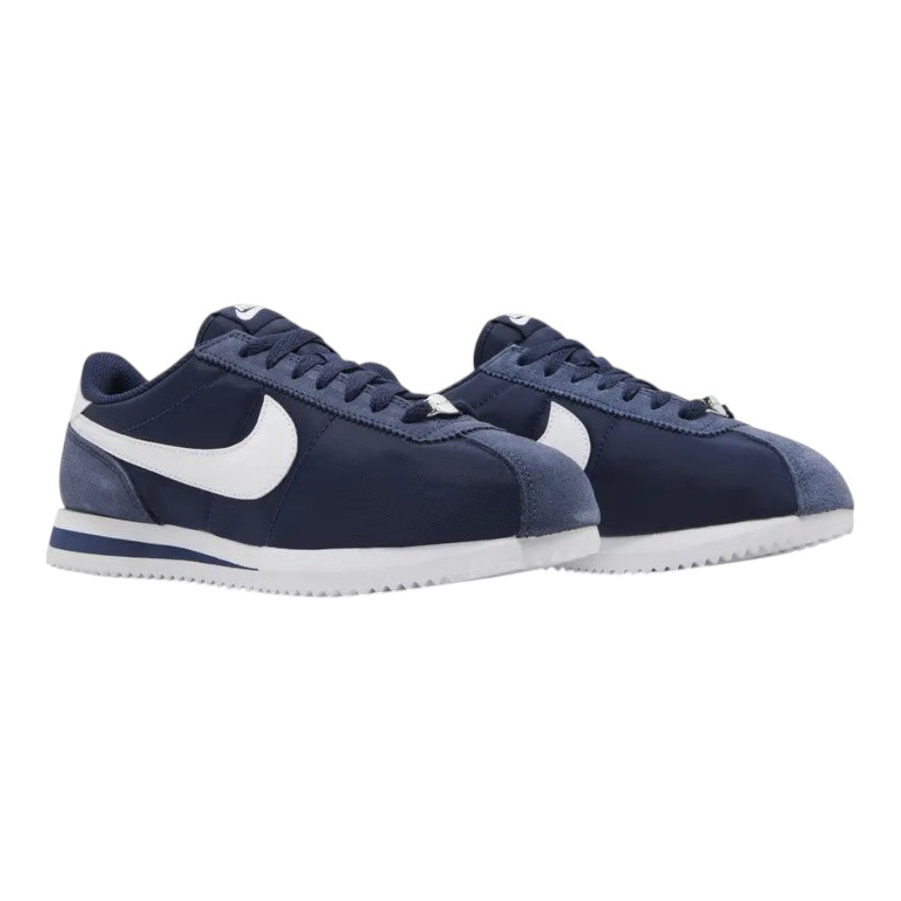 Luxurykicks.store Nike Cortez sneakers in midnight navy with white swoosh, leather and nylon upper, and rubber sole.