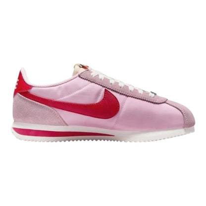 Luxurykicks.store Nike Cortez trainers in soft pink and fire red with sail accents and a classic low-top silhouette.