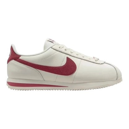 Luxurykicks.store Nike Cortez Valentines Day 2024 sneakers in white leather with red suede swoosh and heel tab.
