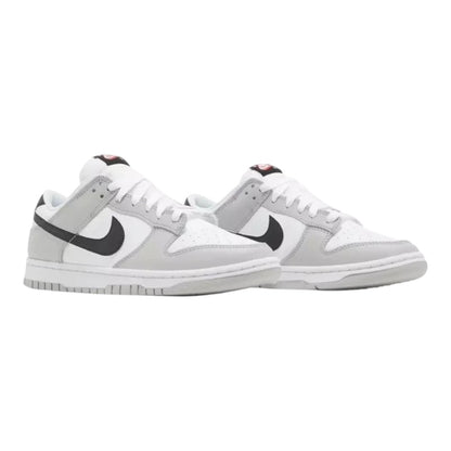 Luxurykicks.store Nike Dunk Low SE Lottery Pack Grey sneakers featuring a white and grey leather upper with black swoosh