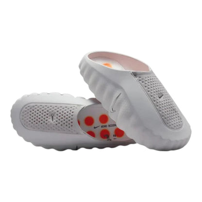 Luxurykicks.store Nike Mind 001 slip-on sneakers in light smoke grey with perforated upper and orange insole detail