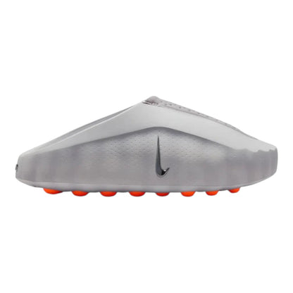 Luxurykicks.store Nike Mind 001 sneaker in light smoke grey with a minimalist silhouette and bright orange sole details