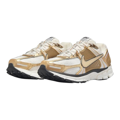 Luxurykicks.store Nike Zoom Vomero 5 sneakers in metallic gold and white with mesh upper and responsive cushioning.