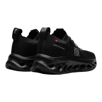 Luxurykicks.store On Running x Loewe Cloudtilt all black sneakers with signature CloudTec sole, rear view