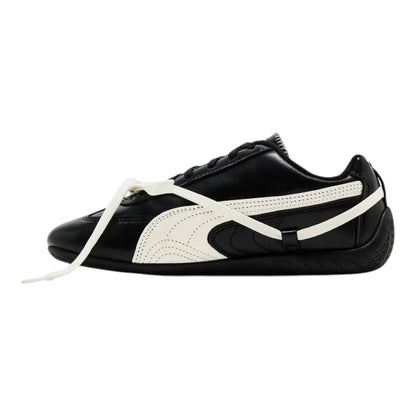 Luxurykicks.store Rosé x Puma Wmns Speedcat Premium sneaker in black leather with white side stripe and racing design.