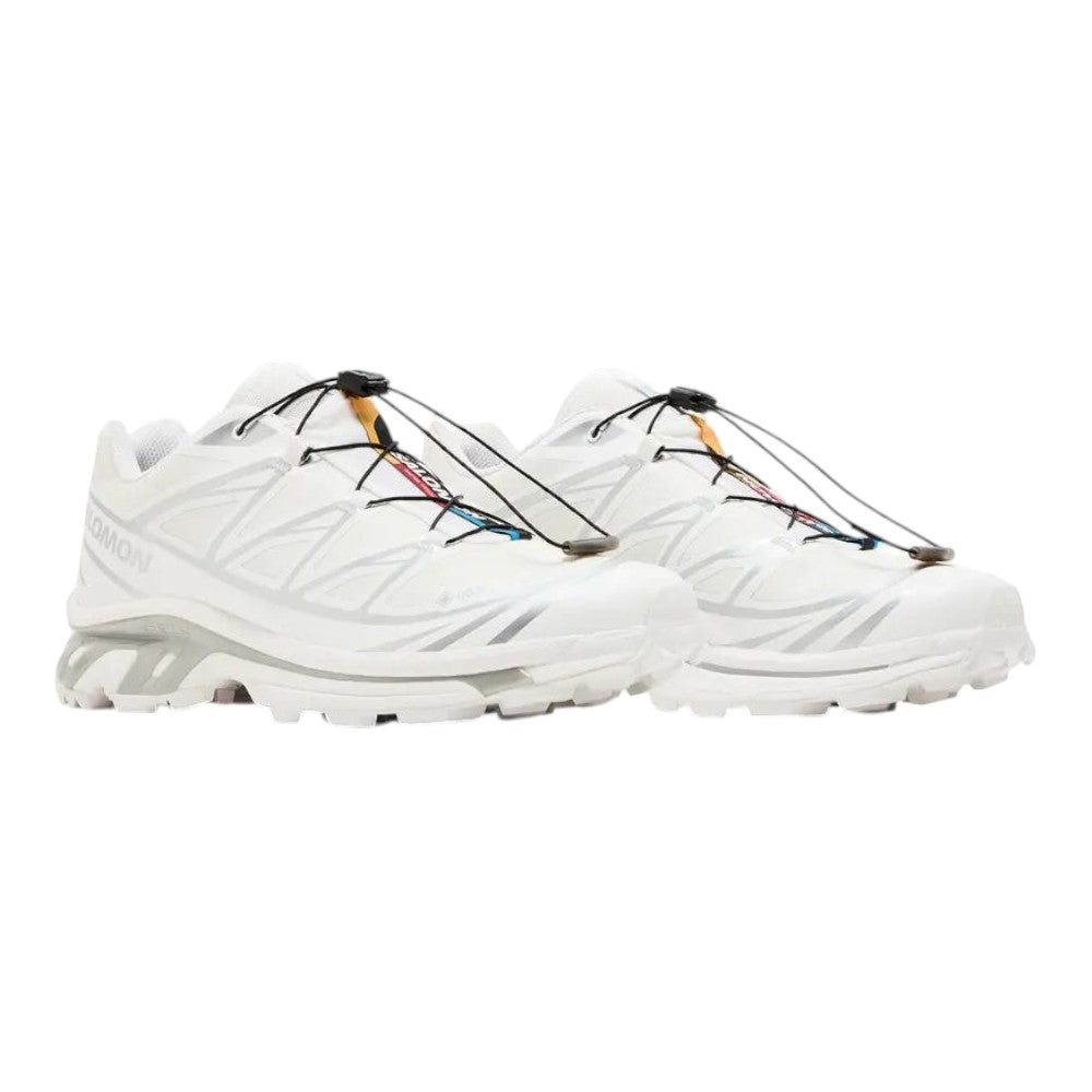 Luxurykicks.store Salomon XT-6 GORE-TEX sneakers in white and silver with quicklace system and rugged trail tread.