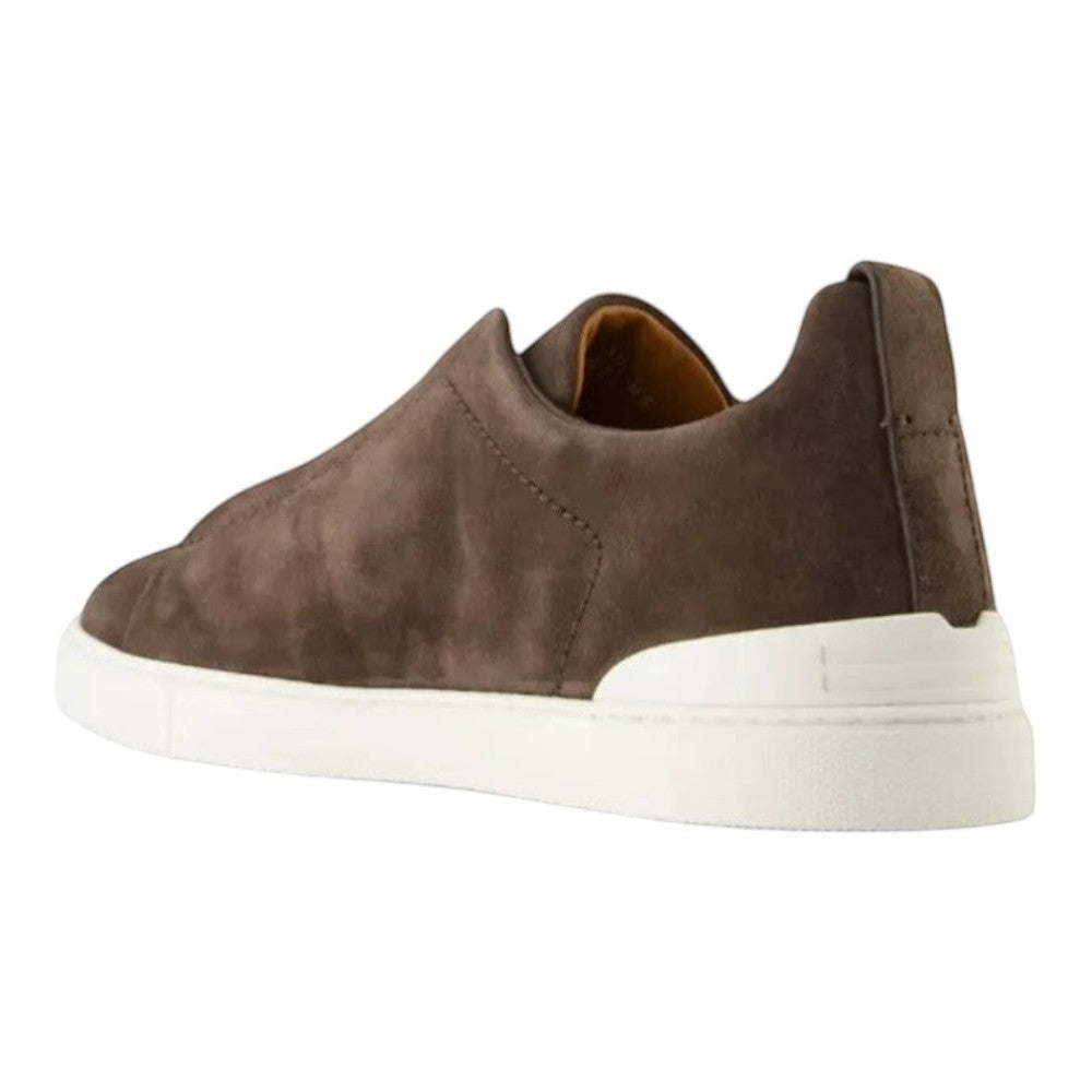 Luxurykicks.store Zegna Triple Stitch brown suede sneakers with a white rubber sole, shown from a rear angle.
