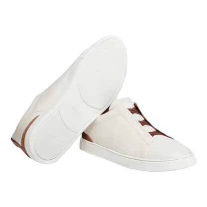 Luxurykicks.store Zegna Triple Stitch low-top sneakers in white leather with brown accents and signature detailing.