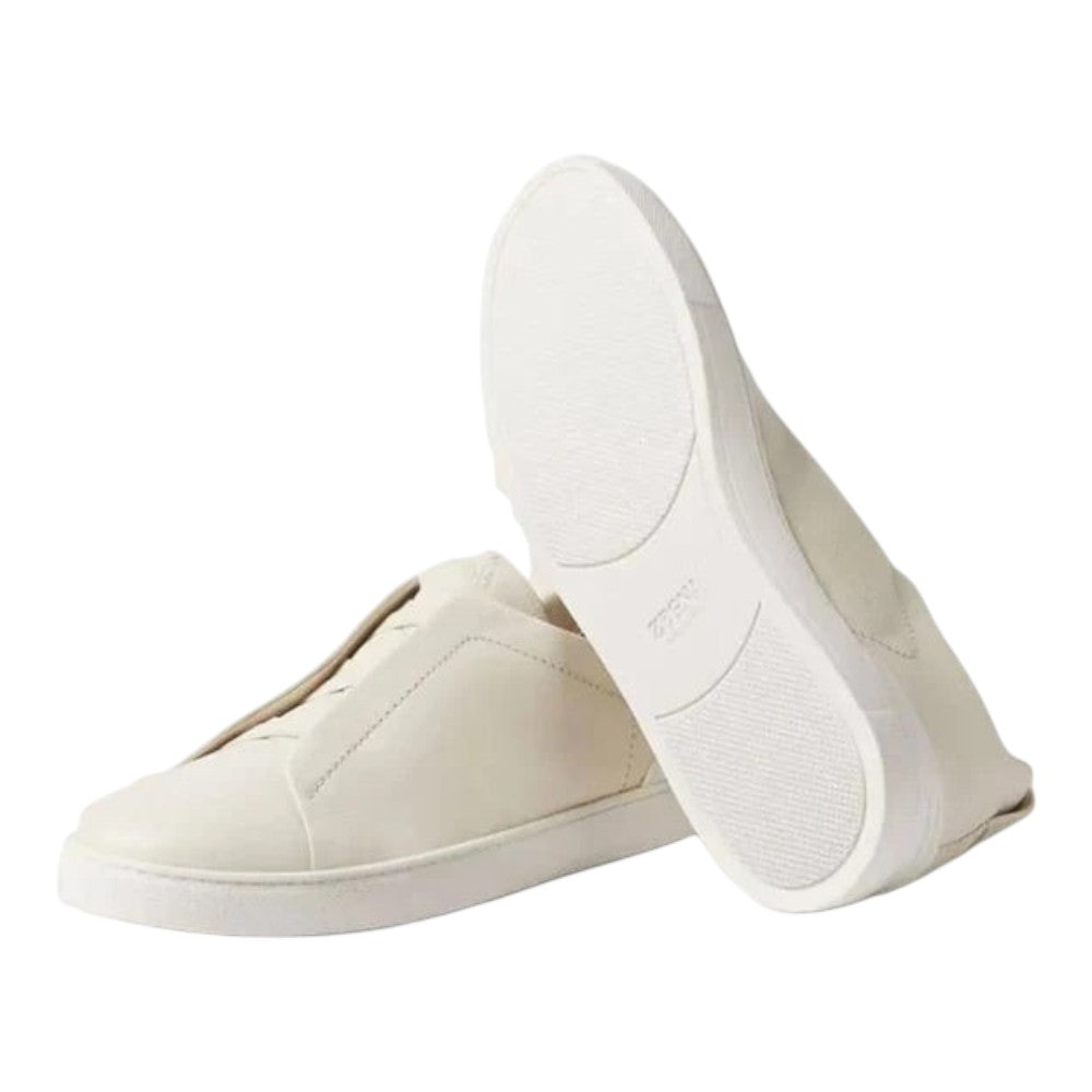 Luxurykicks.store Zegna Triple Stitch SECONDSKIN white leather sneakers with signature elastic cross-over detail.