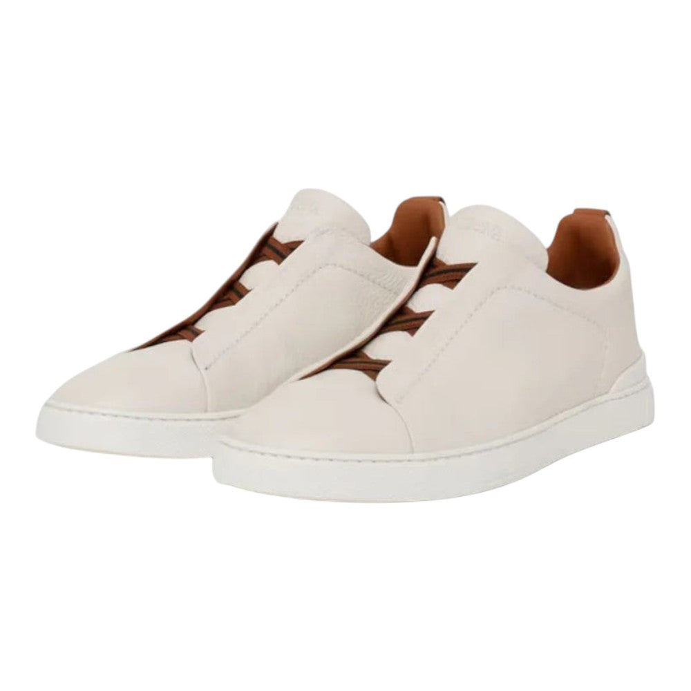 Luxurykicks.store Zegna Triple Stitch low-top sneakers in white leather with signature brown elastic detailing.